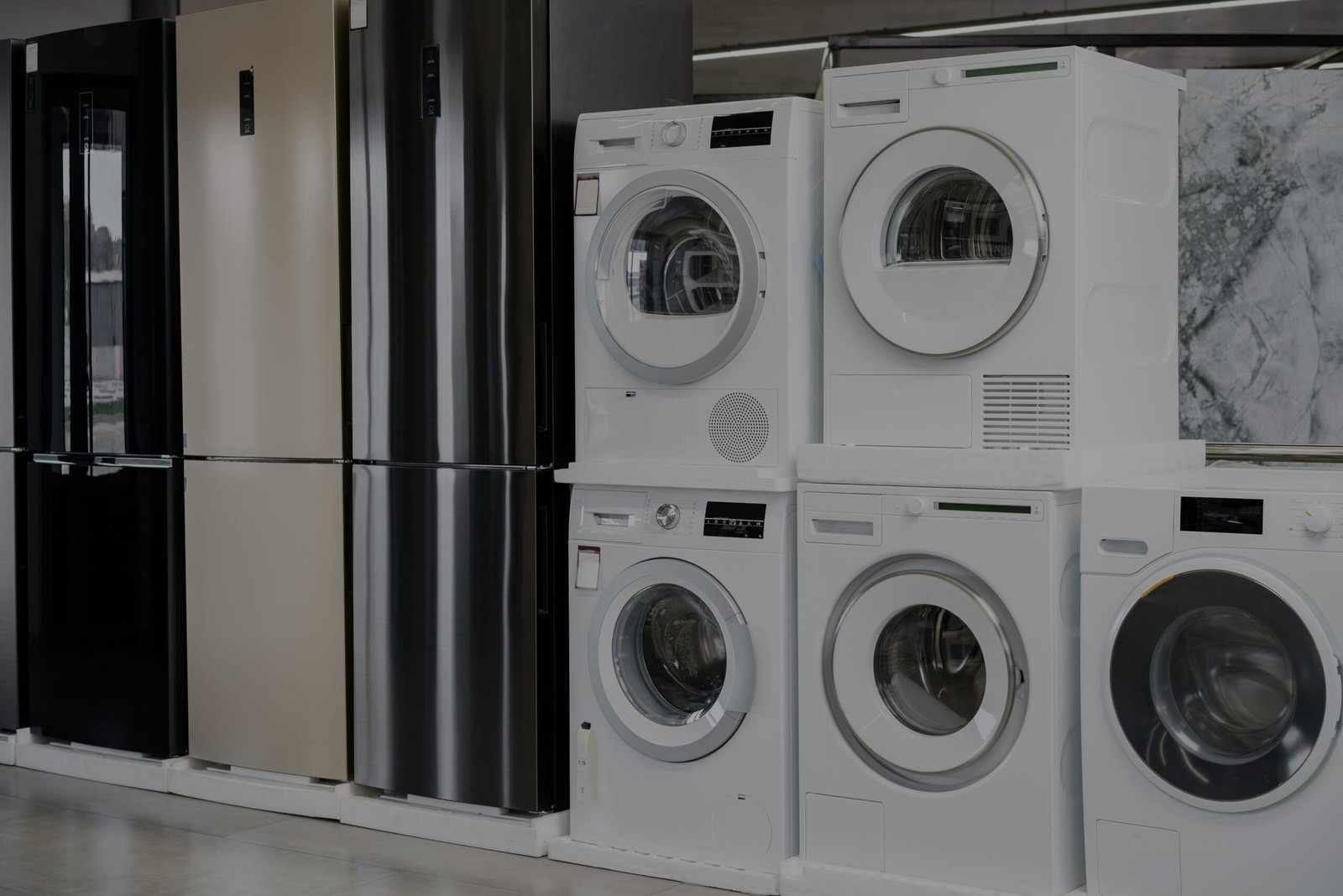 Row of new washing machines in a hypermarket